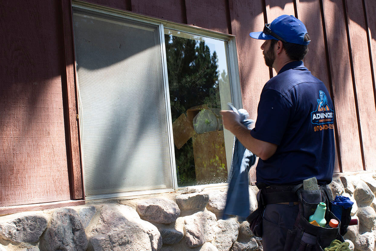 Advanced Window Cleaning professional cleaning window on home