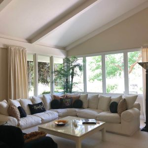 living room with white couch and clean windows